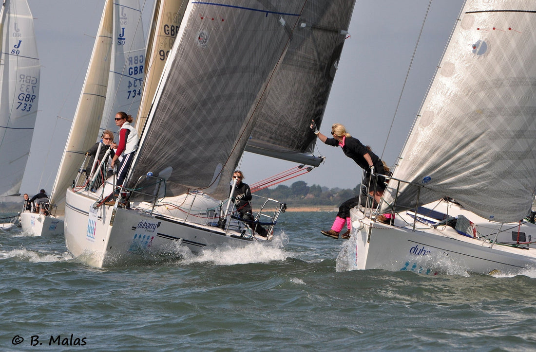 Image shows sailing boats at a regatta